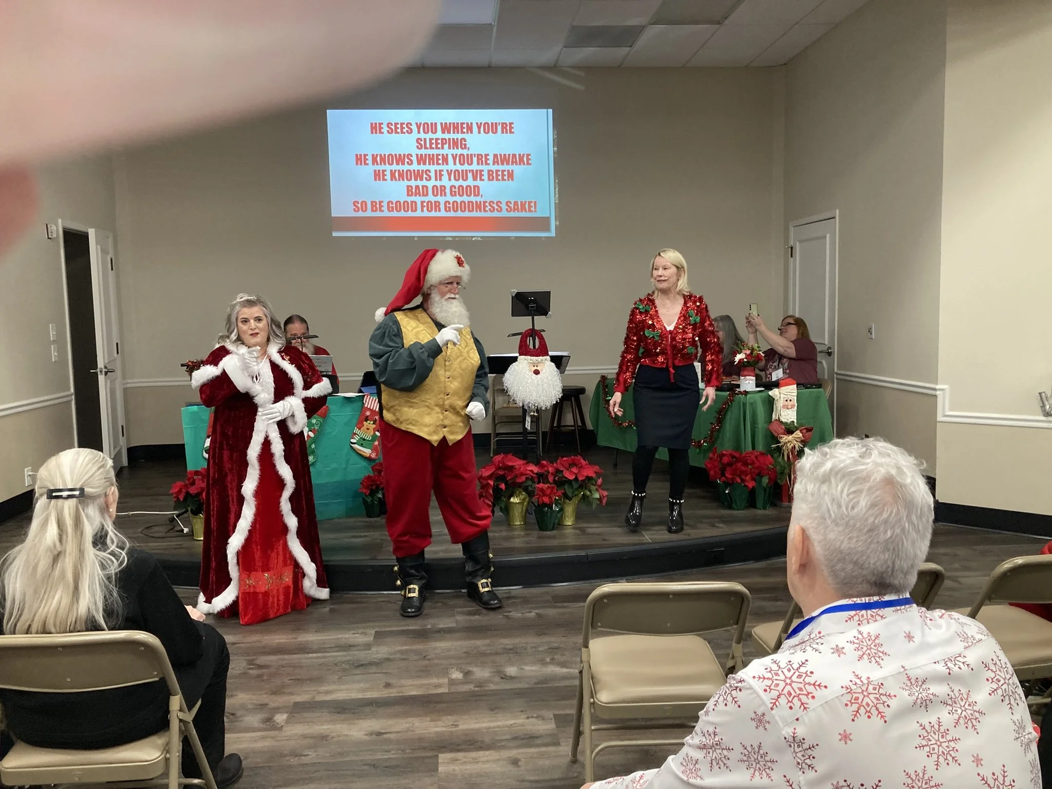 20251218 - Karen Laird Knox (Mrs. Claus) and Richard Atkinson (Santa Claus) as we sing "Santa Claus is coming to town."
