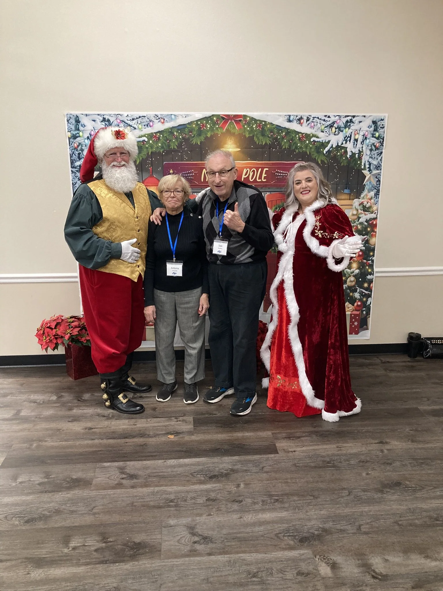 20251218-Antonia and Dale with Santa Claus and Mrs. Claus