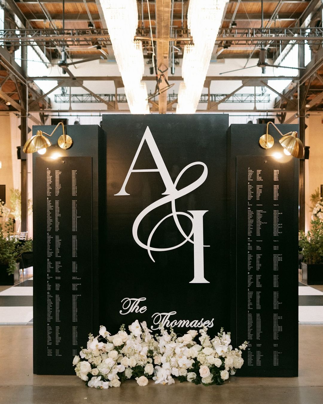 First impressions matter. 🖤

We are still captivated by this incredible seating display installation for Azaria &amp; Ian. The drama, the custom monogram, and those lush white florals&mdash;it's elegance defined. The perfect prelude to an unforgetta