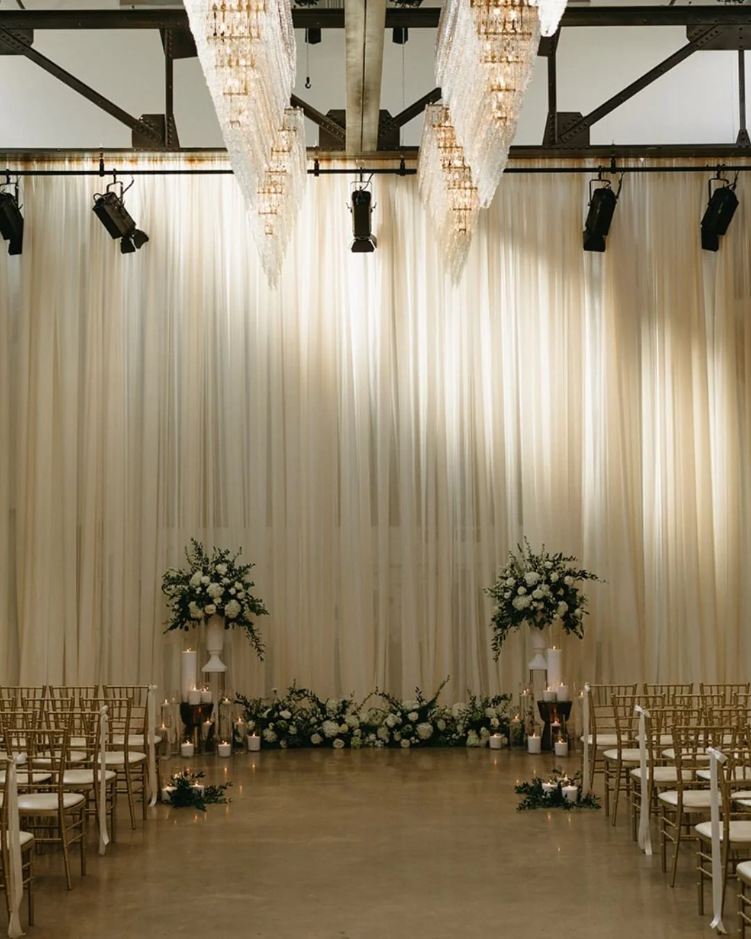 Transforming our space for Tricia &amp; Evan. 🕊️

This breathtaking ceremony installation shows exactly what&rsquo;s possible at The Revelry. Simple elegance, symmetrical design, and dramatic lighting. The perfect setting for the perfect couple.

Fl
