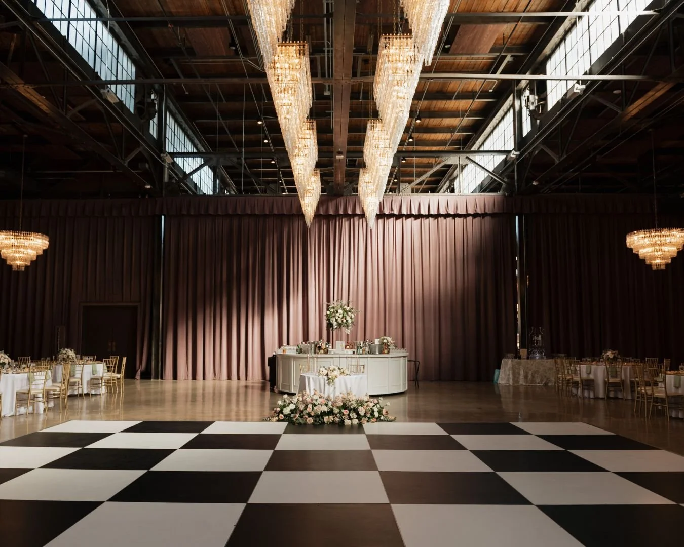Timeless, with a touch of sage. 

A closer look at the details that defined Ali and Johnny&rsquo;s reception. From the gold-rimmed chargers and sage linens to the statement checkerboard floor, every element was chosen to elevate the industrial modern