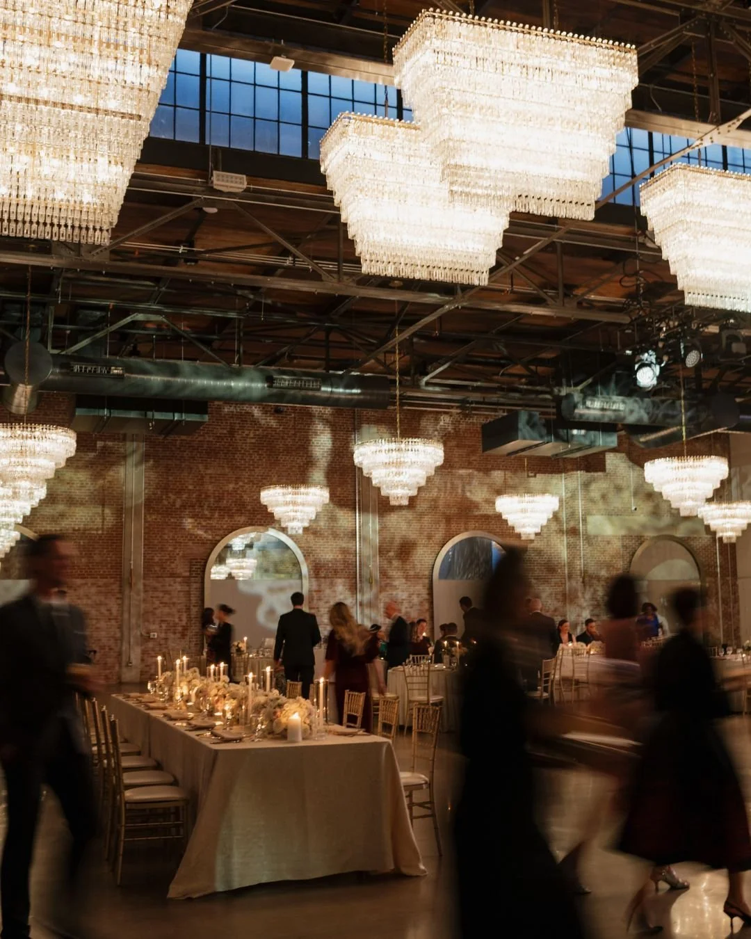A beautiful blur of a night well-celebrated.

There is a specific kind of magic that happens when the candles are lit, the music starts, and the room truly comes alive. Capturing the effortless energy and crystal-draped elegance of Elizabeth and Kevi