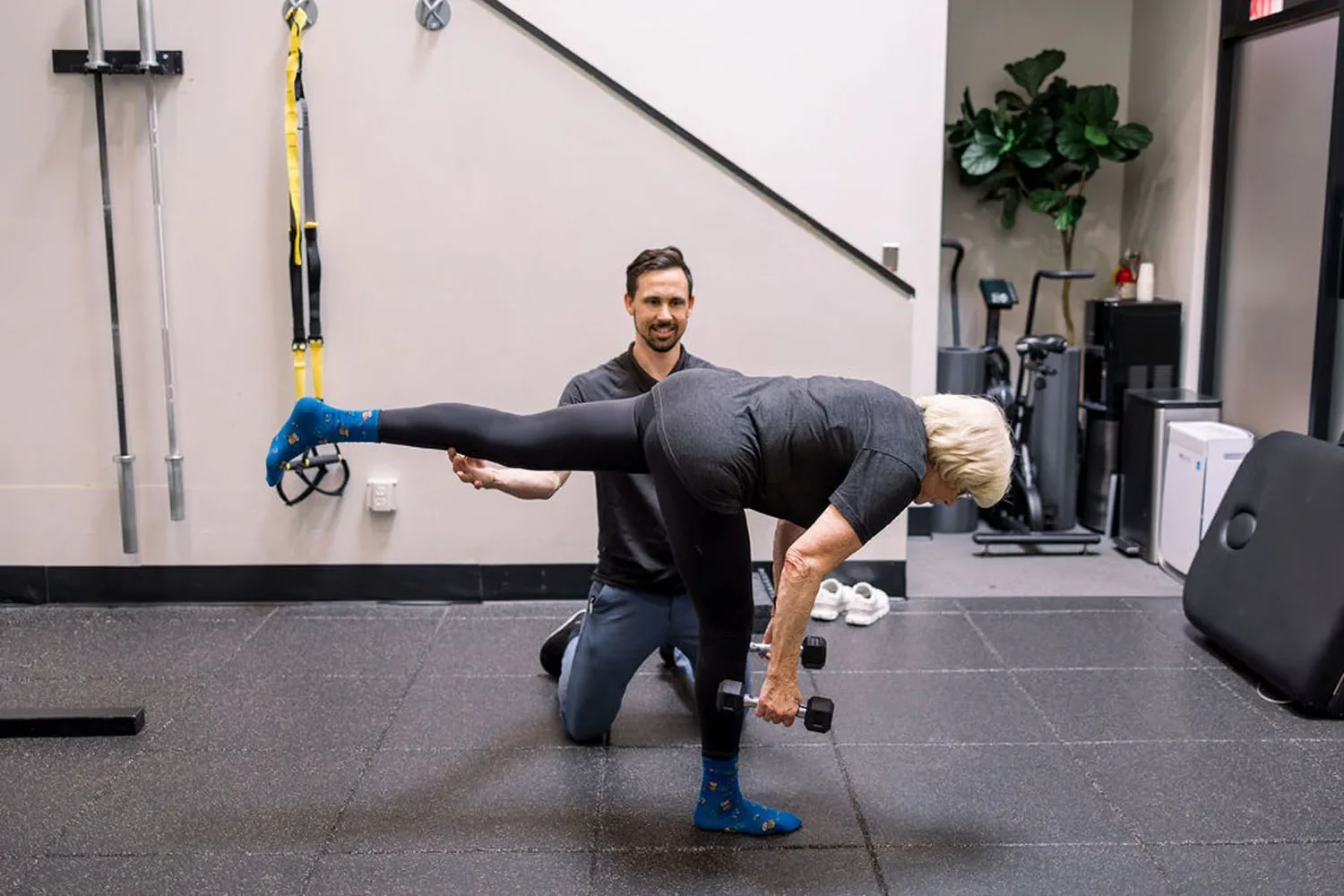 Village Fitness personal trainer coaching a client through a village lunge progression during a one-to-one training session in Glendora