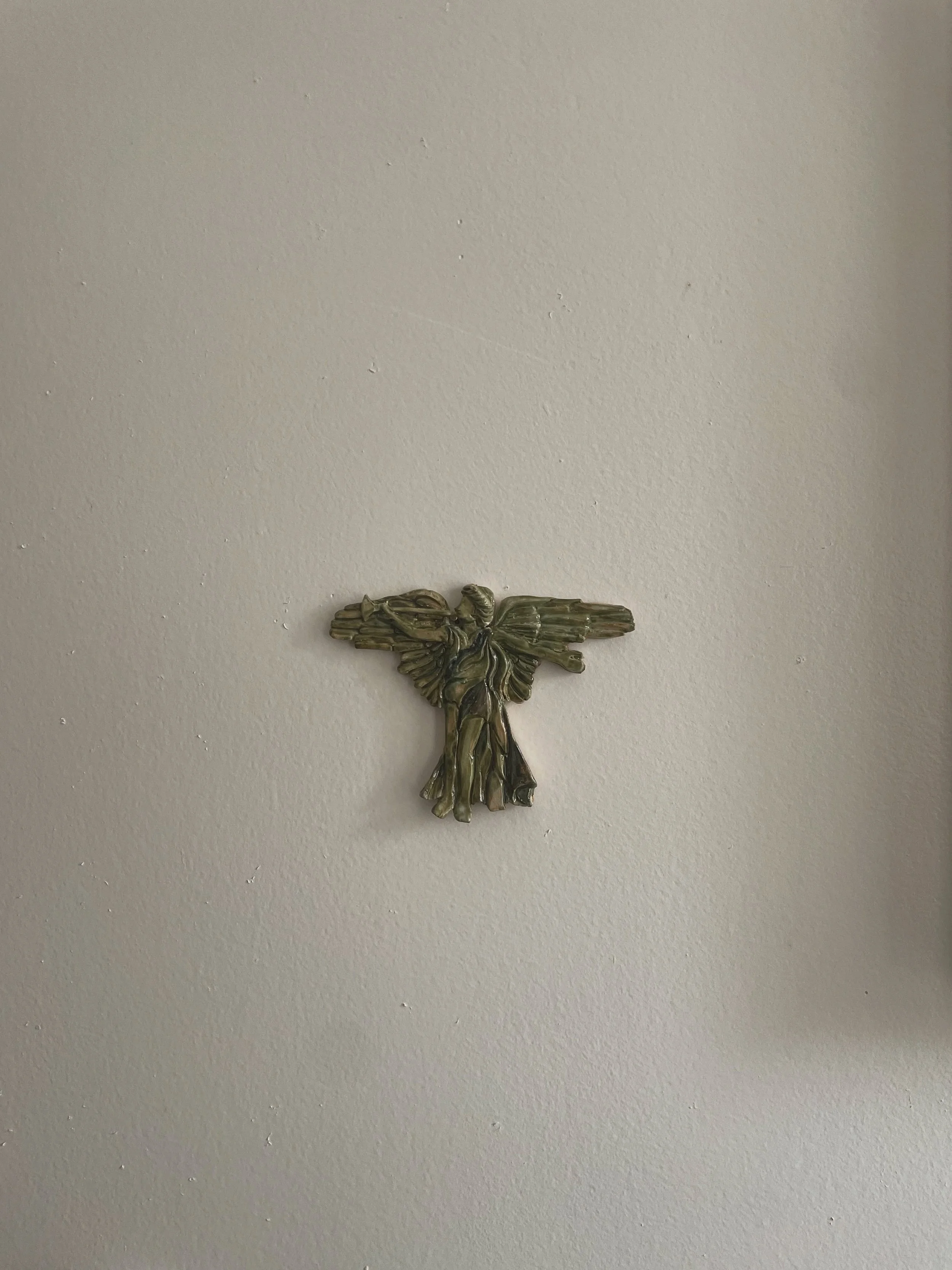 A little clay carving inspired by the brass reliefs at Grand Army station (The Irresistible Romance of Travel by Jane Greengold)