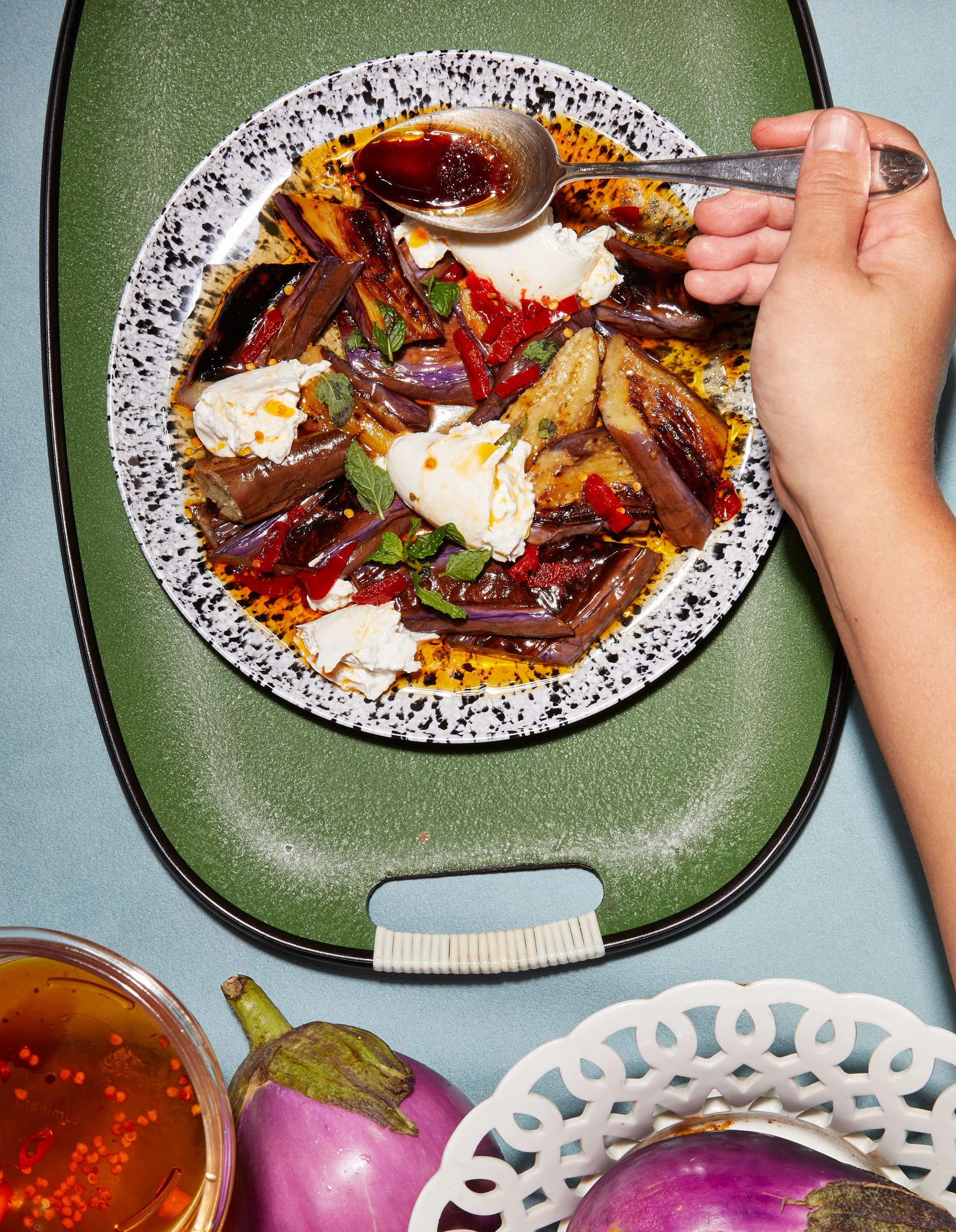 Candid food photography: hand saucing a plate by Tara Donne, photographer & director working in NYC & LA