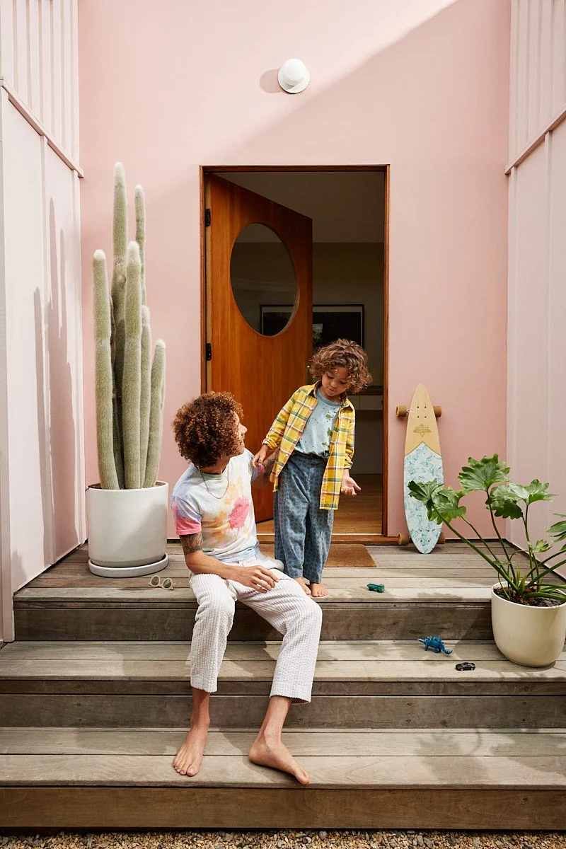 Architectural lifestyle photography: dad and son on front stoop by Tara Donne, photographer & director working in NYC & LA