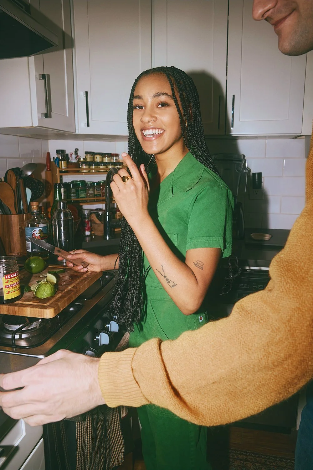 Candid lifestyle photography: couple making cocktails in the kitchen by Tara Donne, photographer & director working in NYC & LA