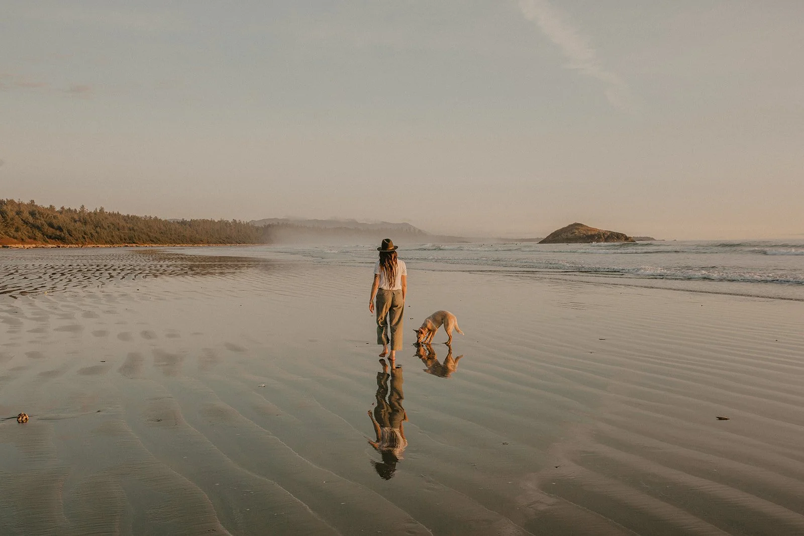Woman walking on be on Vancouver Island