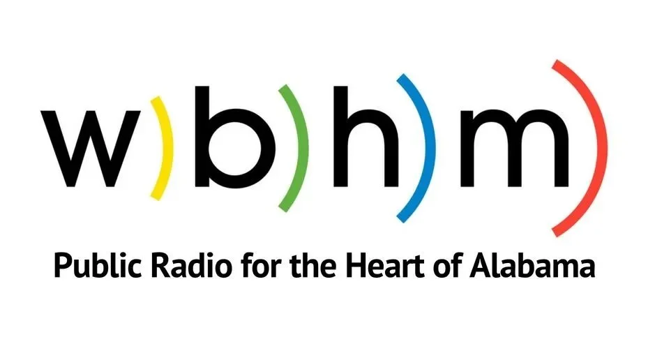 Logo for Wbhm, a public radio station in Alabama, featuring colorful parentheses around the letters 'wbhm,' the frequency 90.3 FM, and the website wbhm.org, with the tagline 'Public Radio for the Heart of Alabama.'