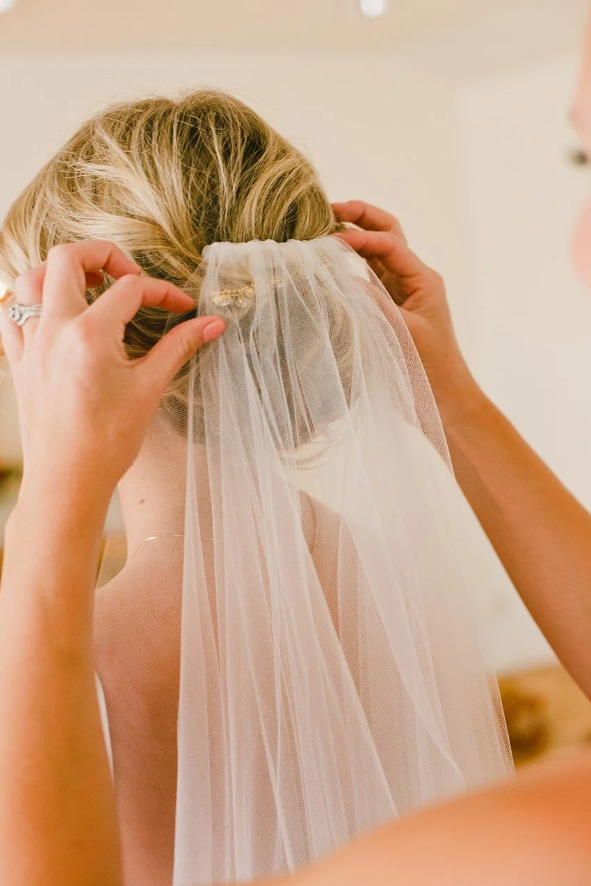 BR-Cohn-Winery-bride-geting-veil-placed.jpg