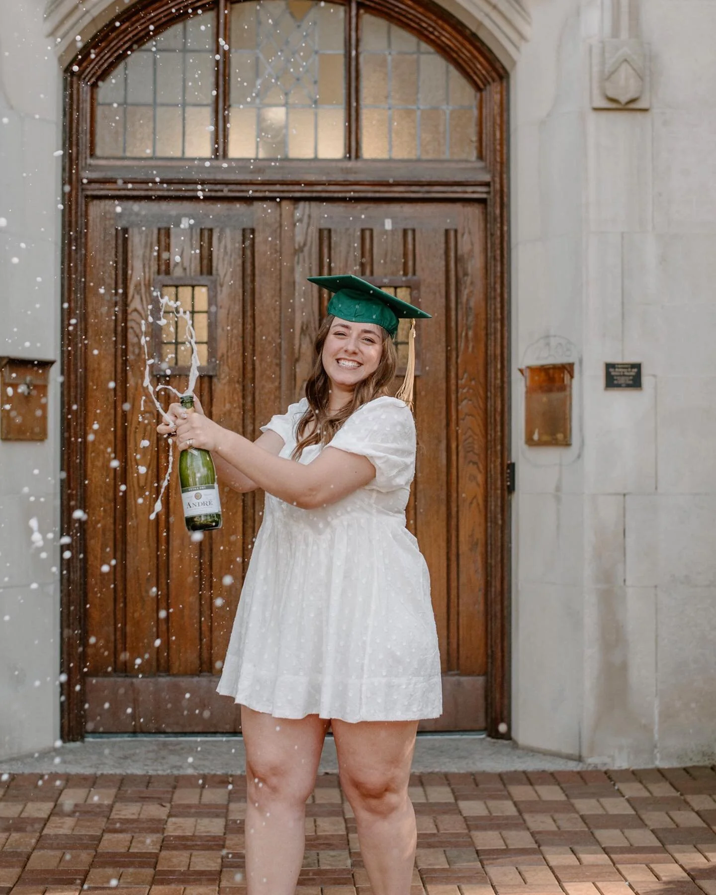 HOW ABOUT A CHAMPAGNE CELEBRATION FOR MY FIRST MSU GRAD SESSION OF THE YEAR💚🤍 @riamcdermott killed it in her session on Wednesday. We were blessed with some awesome weather, I&rsquo;m so excited to share the rest with you guys!! Grads, this is your