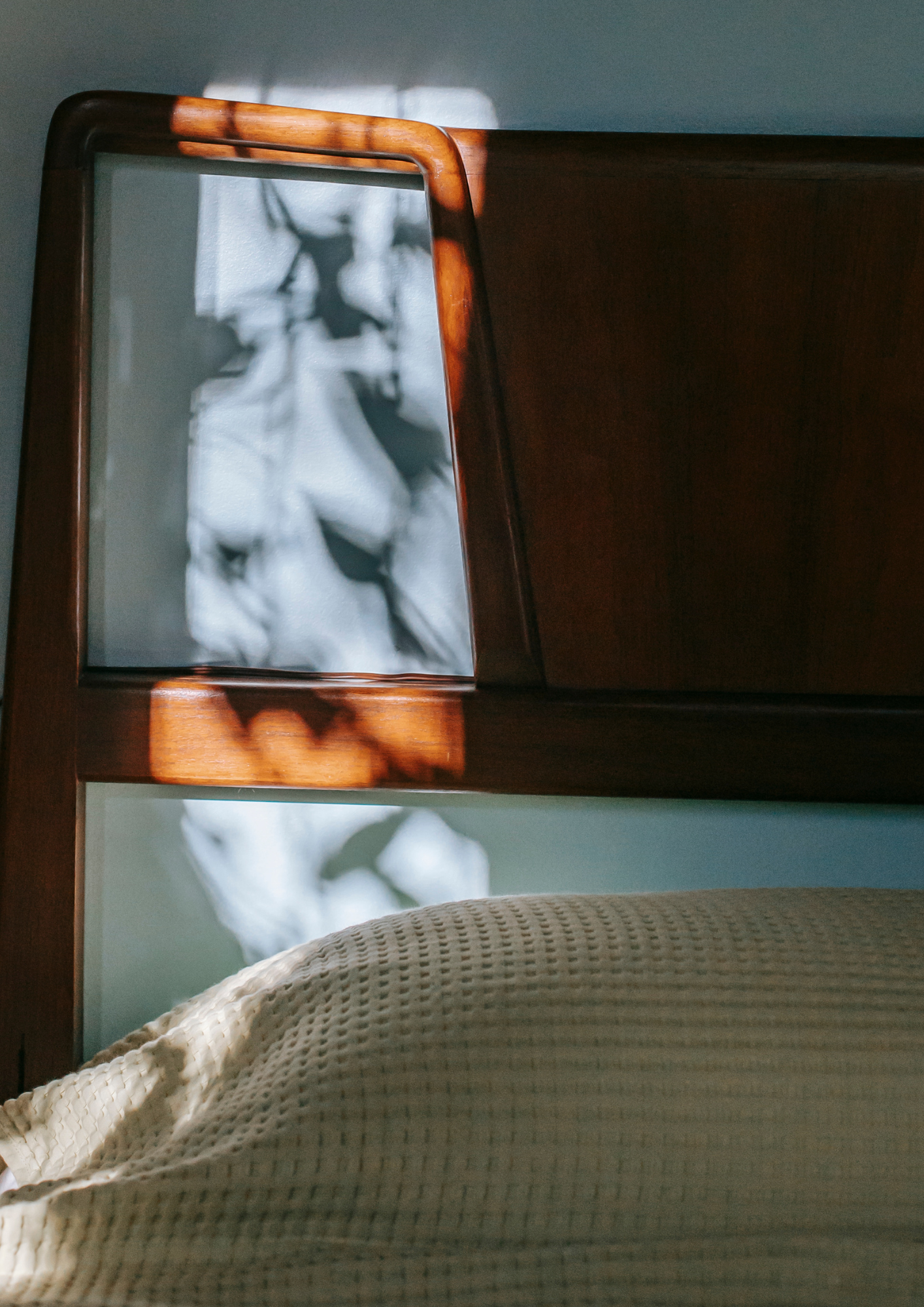 headboard with the window reflection