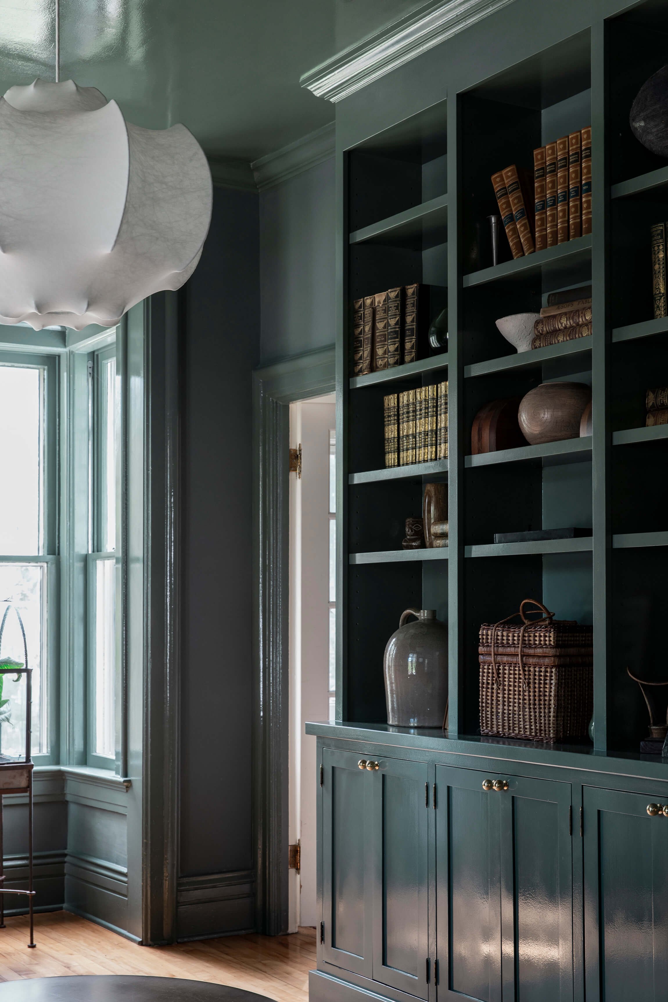 A built-in bookshelf and reading nook by a window