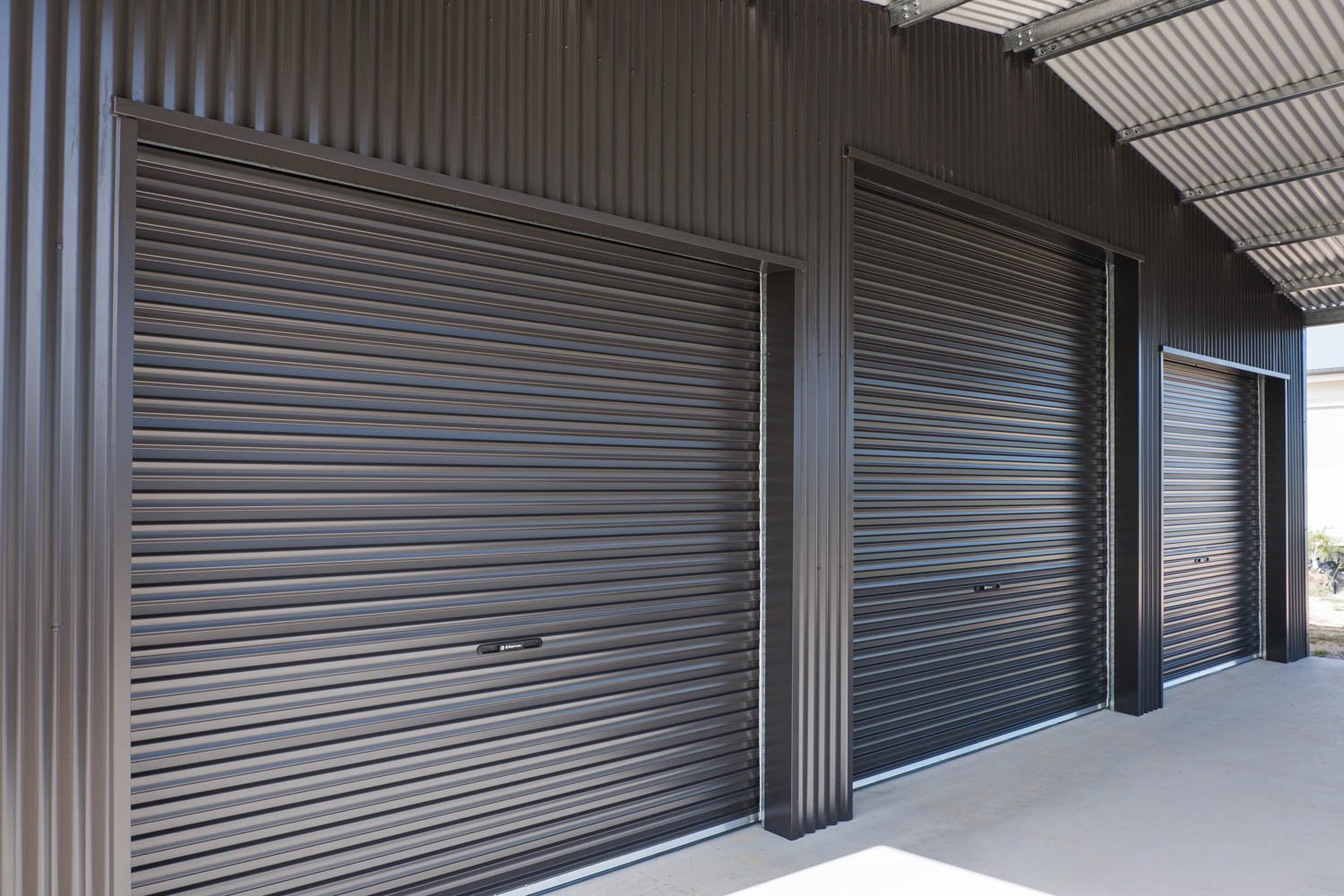 shed with three roller doors