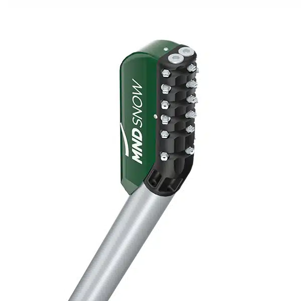 Close-up of a tennis racket stringing machine with a green and black housing and a silver handle.