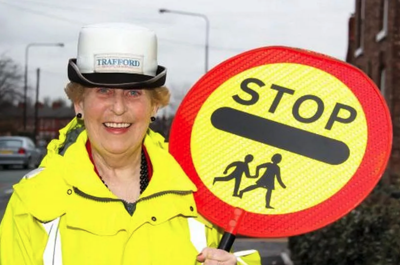 Sale lollipop lady celebrates 53 years with “absolutely no plans to retire”