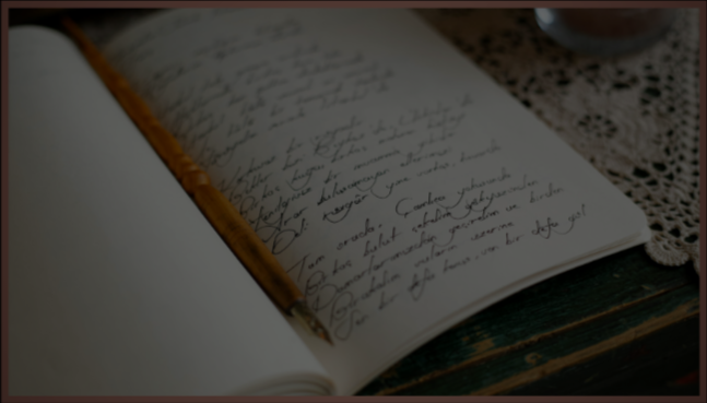 Open handwritten journal on a wooden table with a lace cloth nearby.
