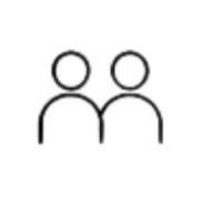Silhouette of a person standing in front of a window with blinds, with a cityscape at night outside.