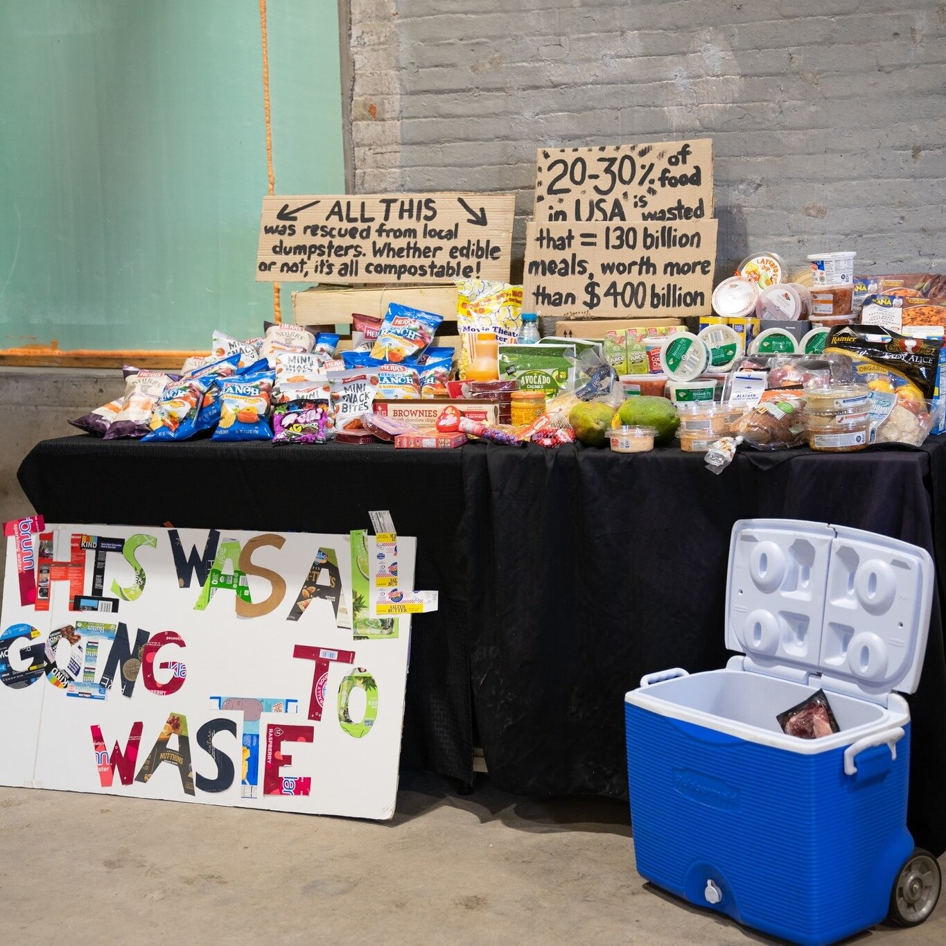 Do you know how much food gets wasted every day?

What you see here is a very small sample size of food that was rescued from dumpsters.  You read that right: it was in a dumpster ready to be sent to landfill disposal.  Fresh fruit, hummus, bread, di