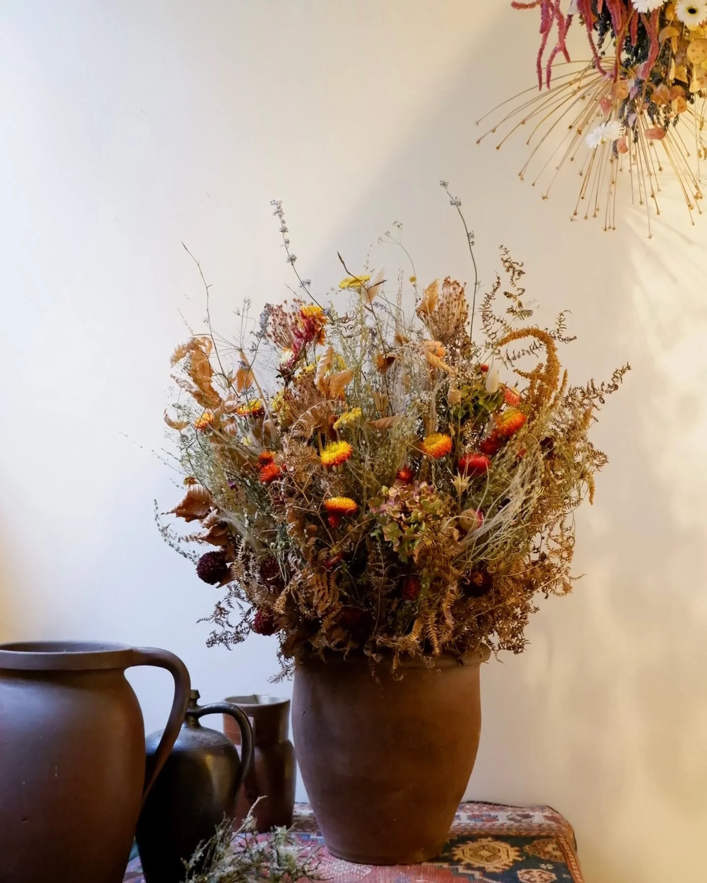 From ember to flame. 

The order was for a large fiery arrangement to fill in the gap of an unused fireplace.

I loved creating this commission. The brief offered a chance to really think artistically with the flowers.

A natural ombre from bottom to