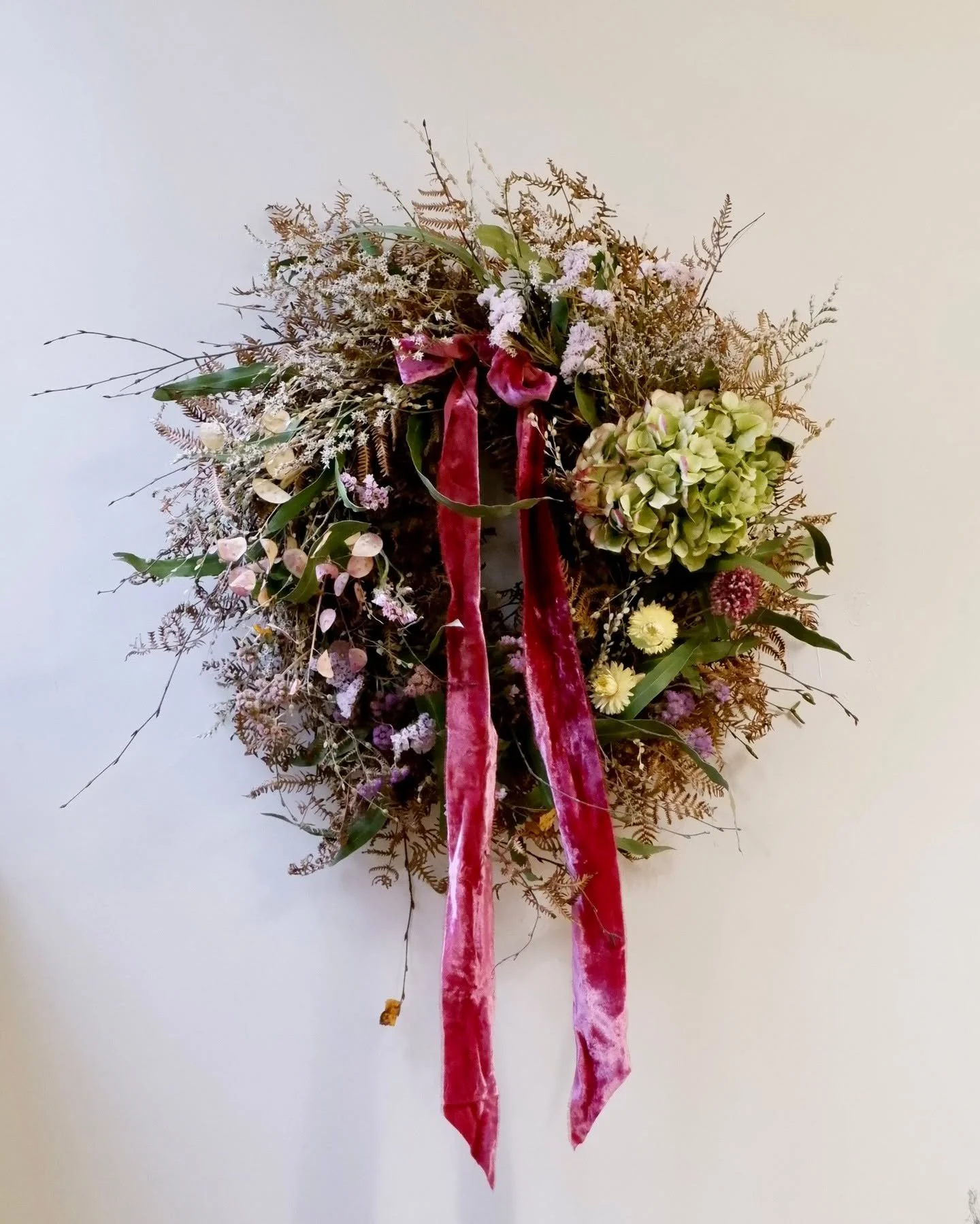 Truly scrumptious! A Ramshackle (Non-Wilting) Christmas Wreath that was crafted on the studio table this morning to be sent out this week.

As usual, every one of these wreaths has its own distinct festive personality, and this one was totally plum. 