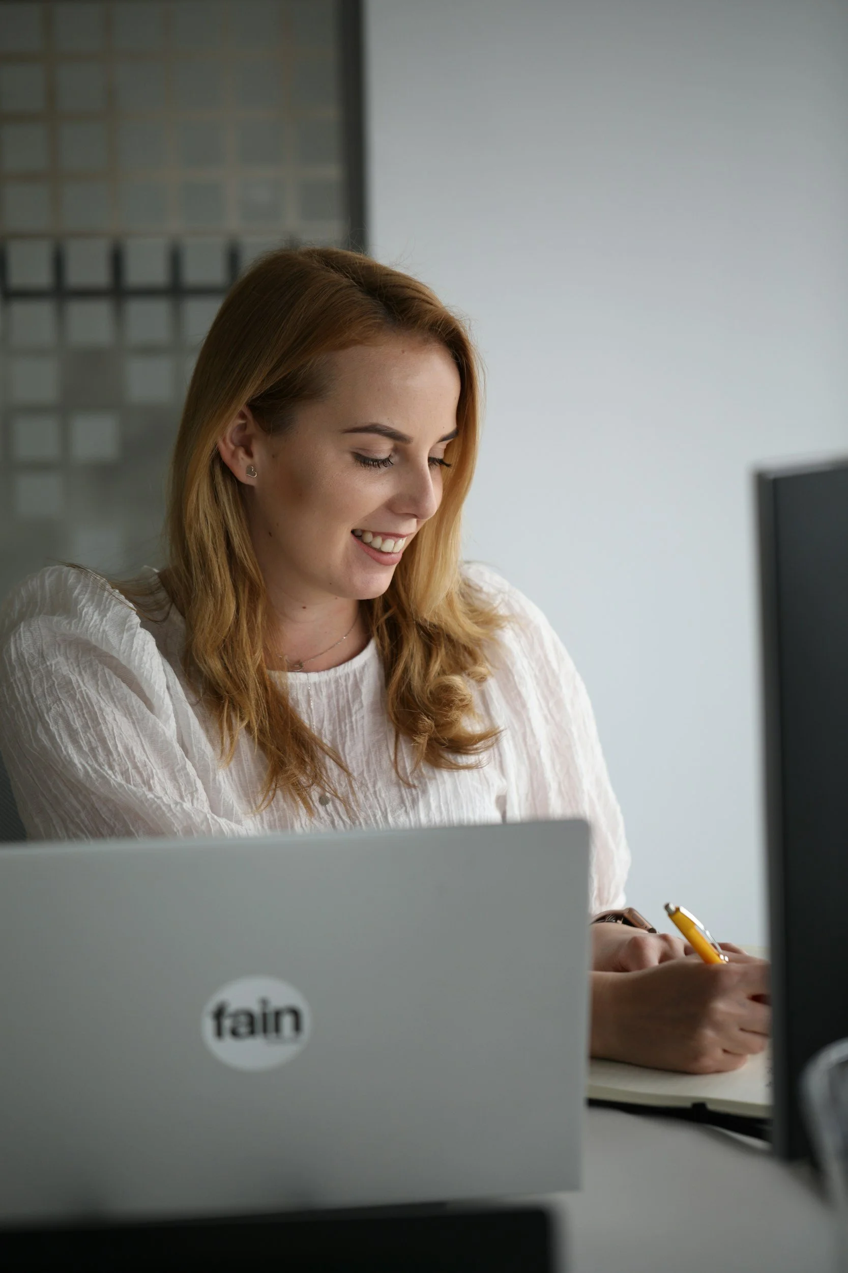 Woman working happily and focused