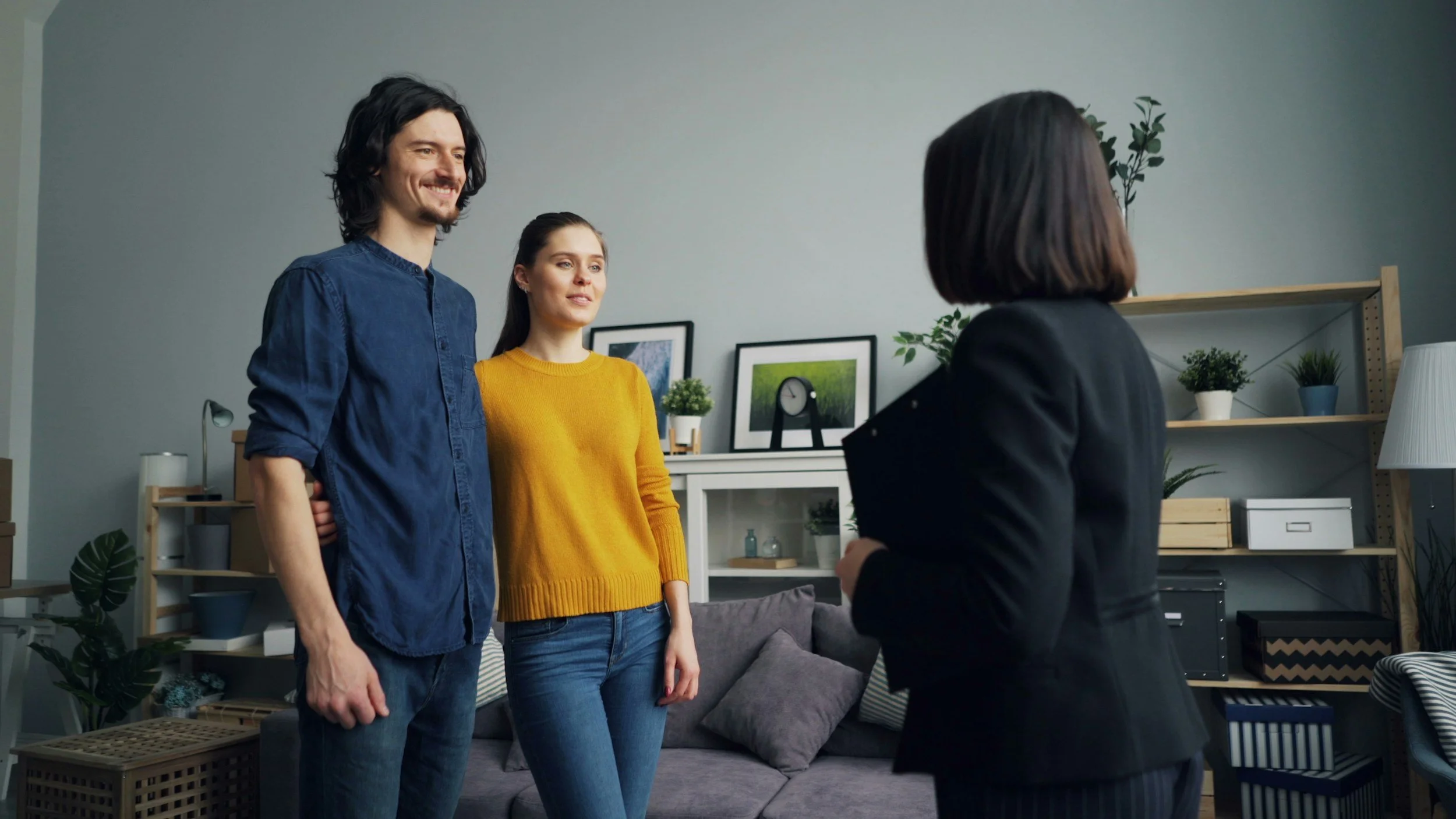 Couple talking to therapist in office neutral