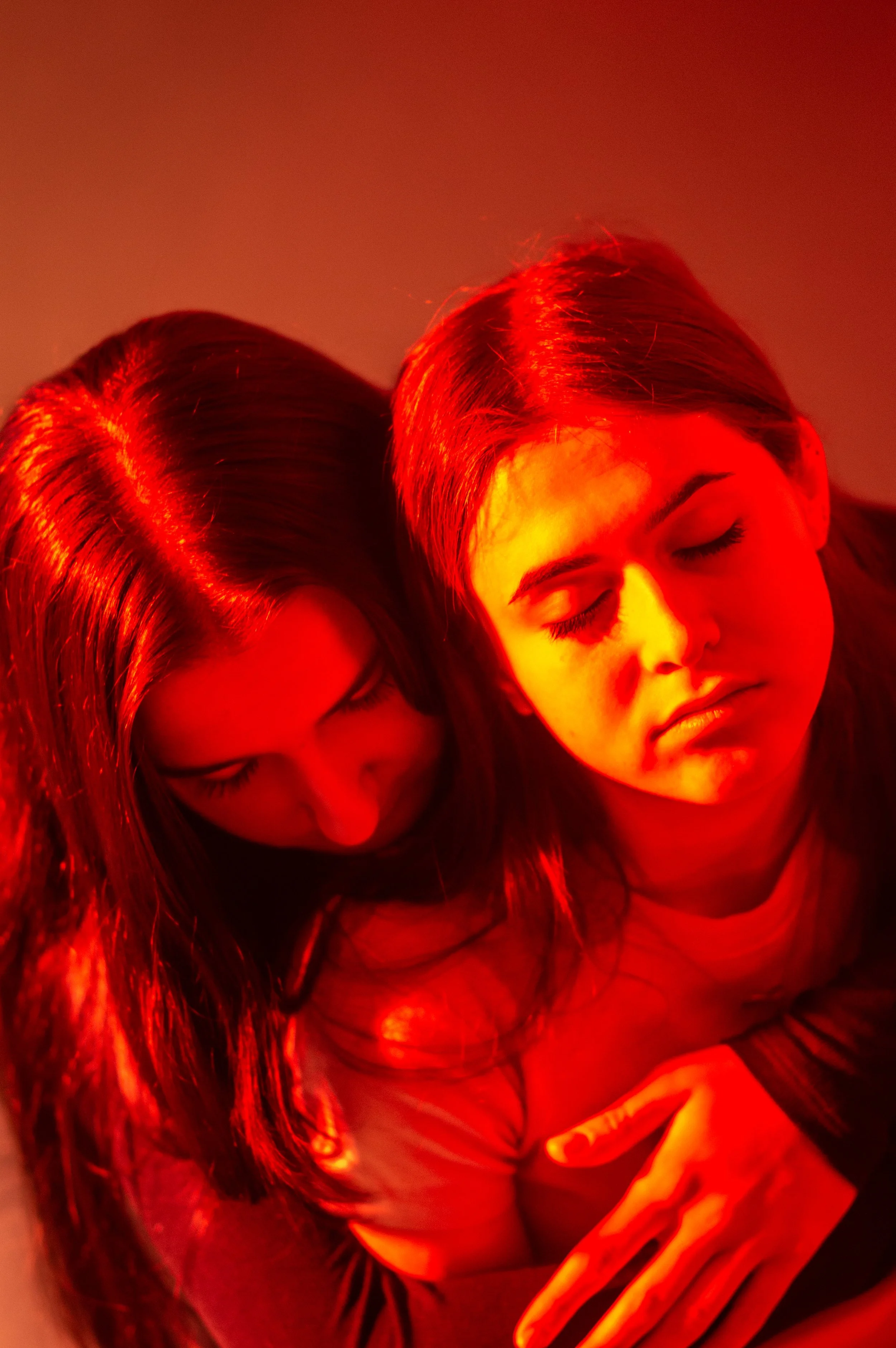 A sanctuary built out of arms and closed eyes. The devastating moment where support simply means anchoring to someone who is drifting into defeat.