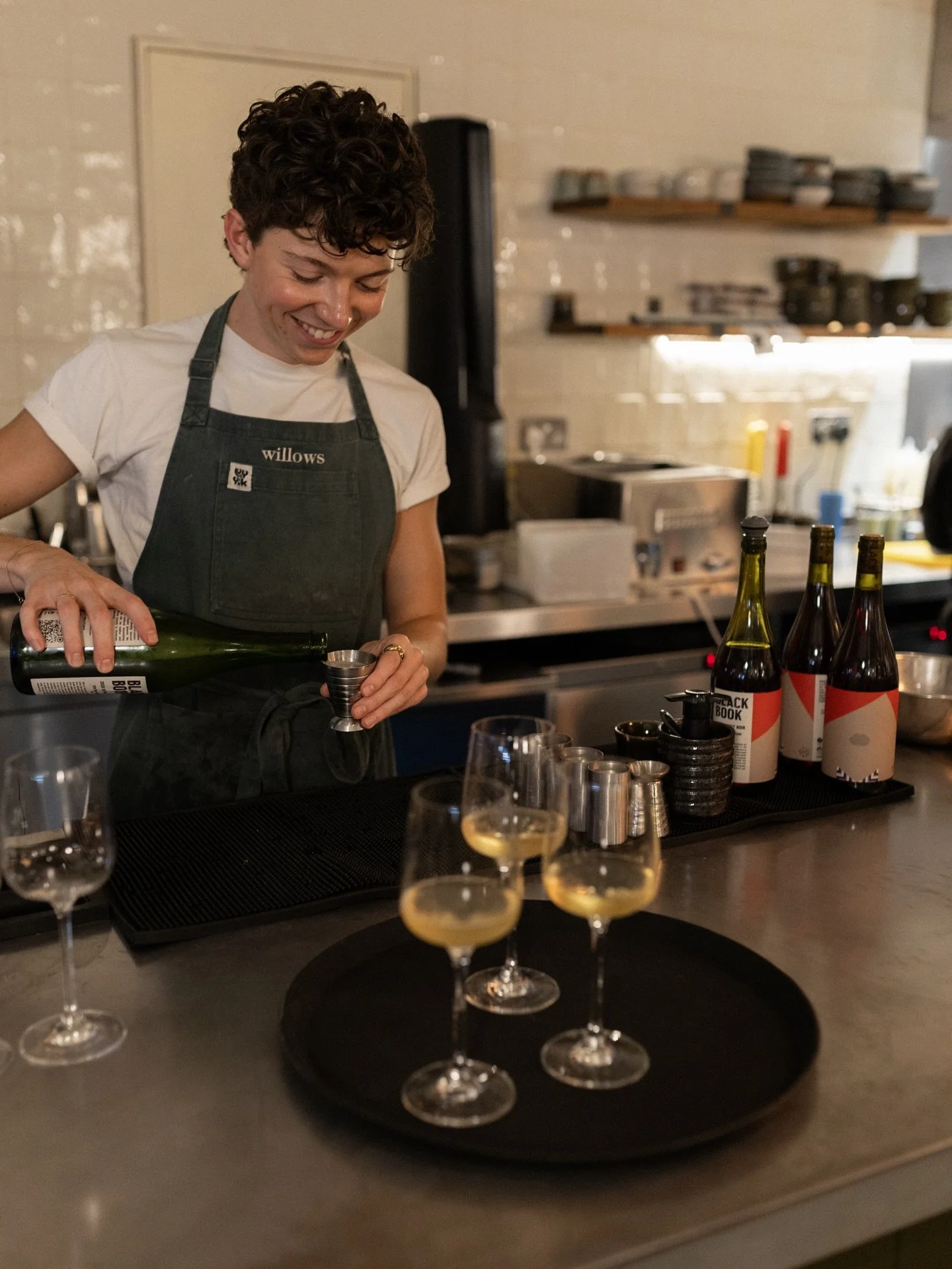 a glass of wine over small plates >>>>