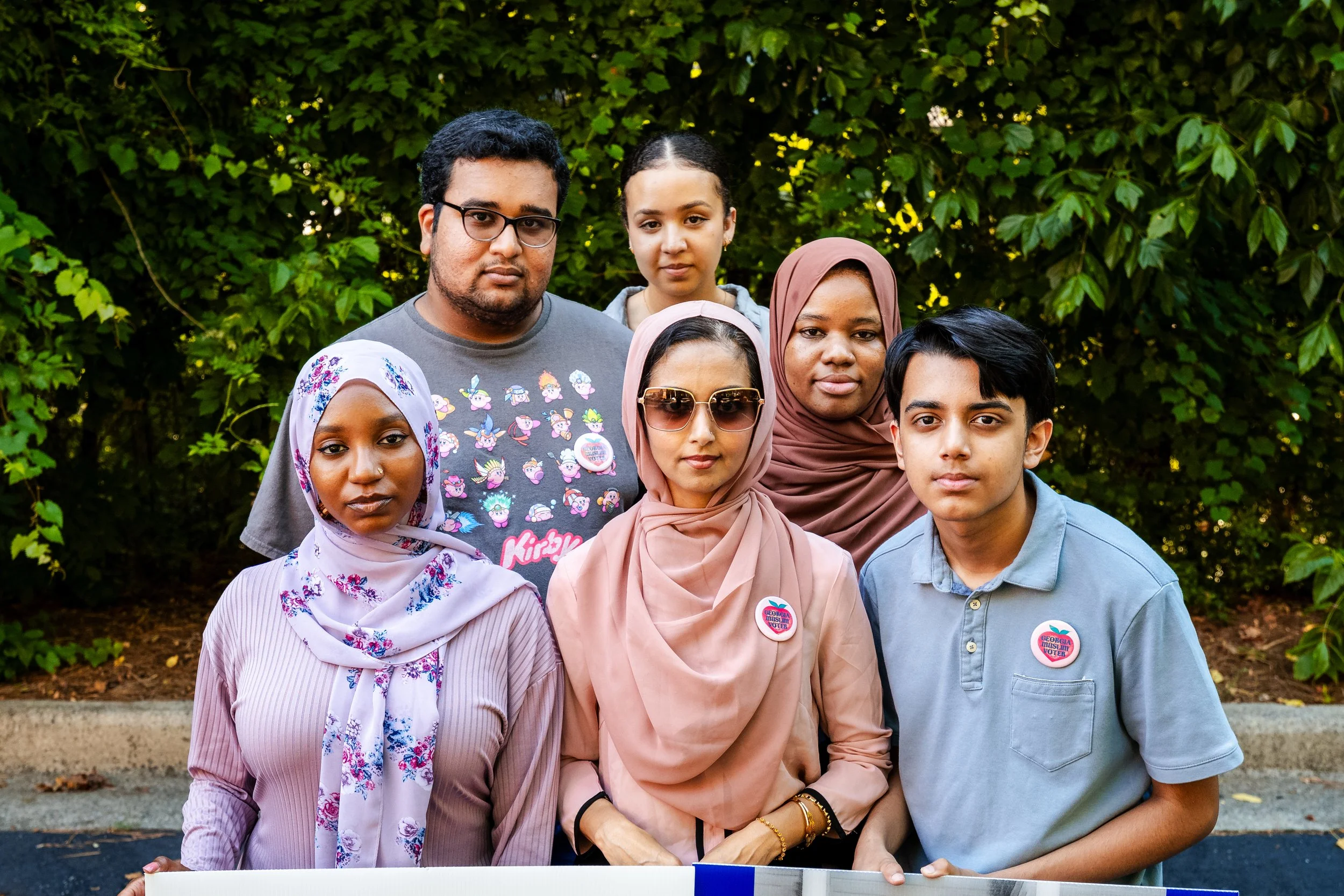 GAMVP team members Xan-Rhea, Suraiya, Shafina, Urooj, and Hibah standing together with their arms crossed