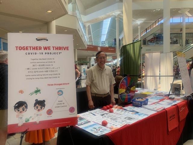 Dr. Howard Eng at the TWT COVID-19 information and AAPI  Community COVID-19 Survey table.