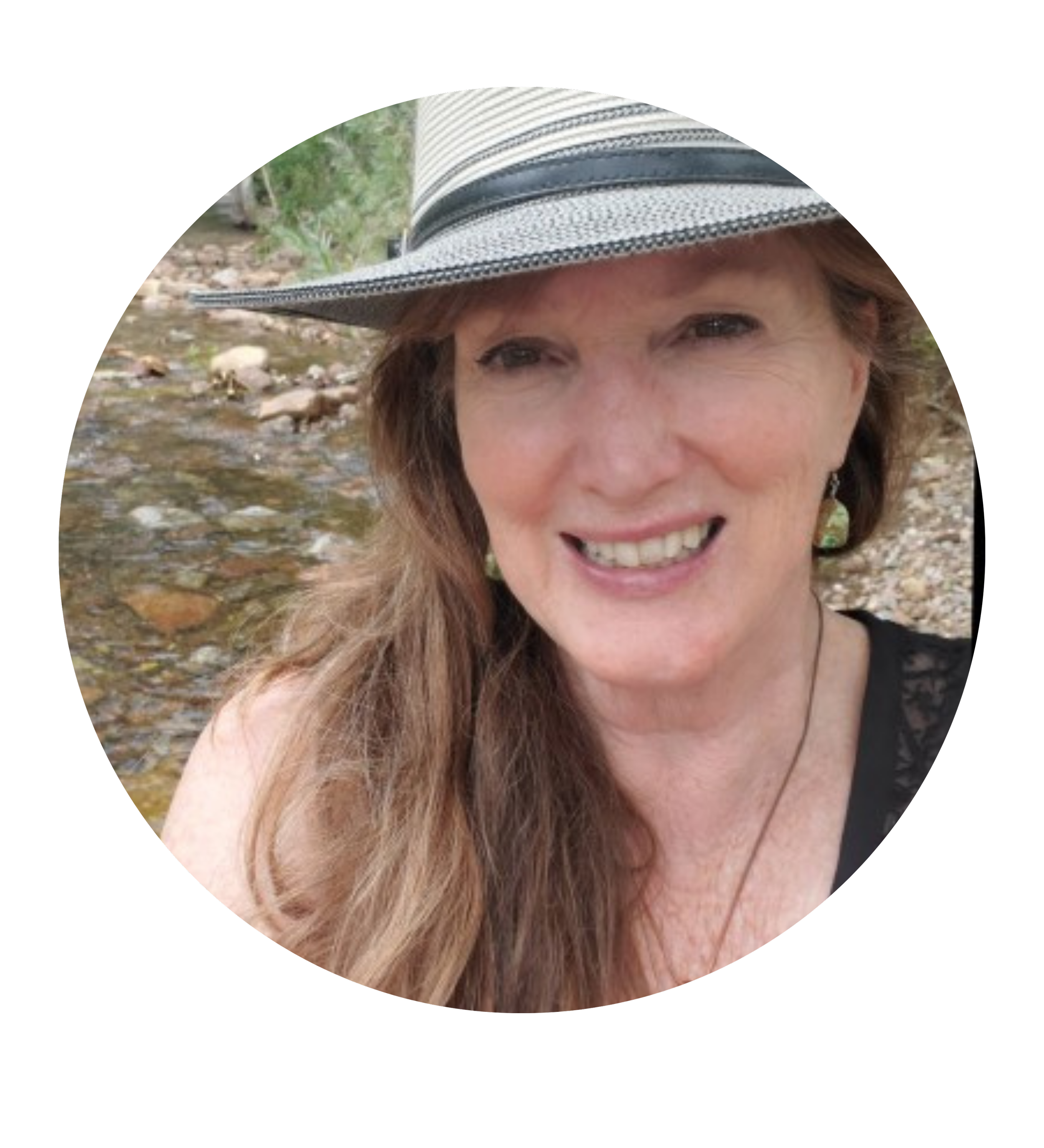 A headshot of a woman with shoulder-length brown hair, smiling against a neutral background.