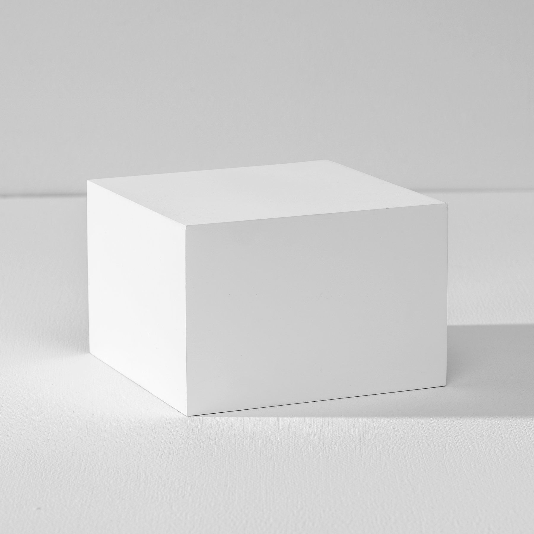 White product photography riser on a white background