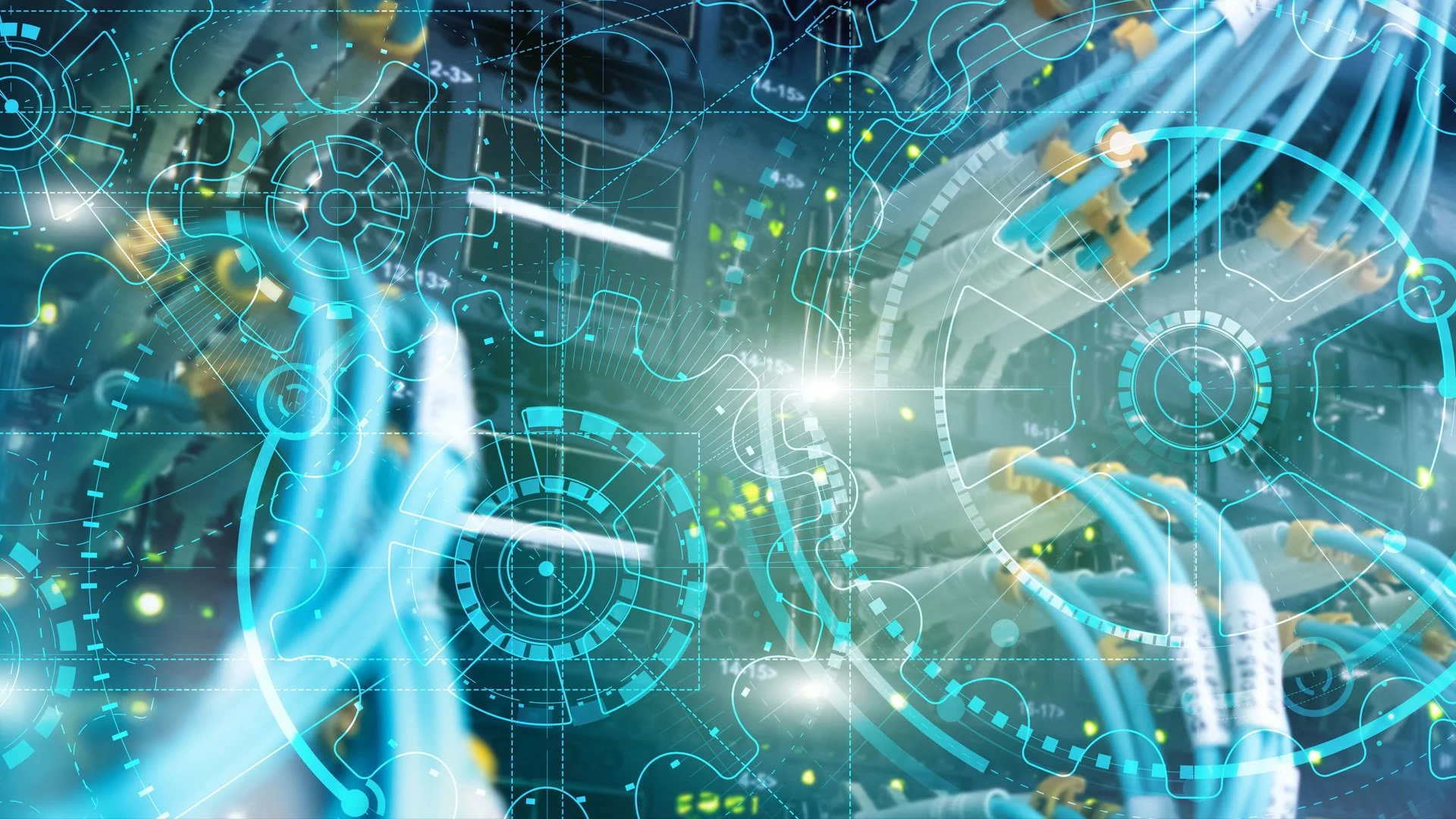 A person working on computer equipment with digital overlay graphics of circuit boards, gears, and data visualization.