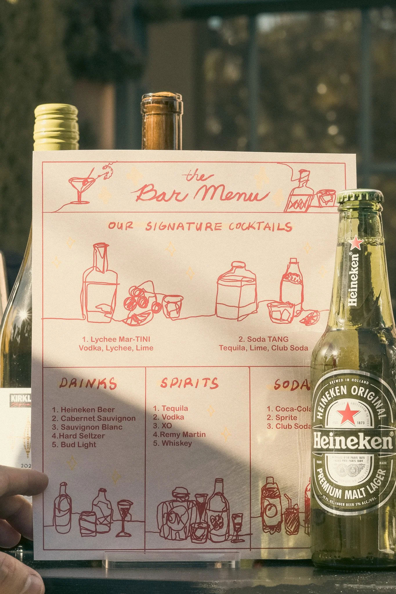 A customized cocktail menu at a mobile bar at a wedding. His and Hers cocktail drinks at a wedding