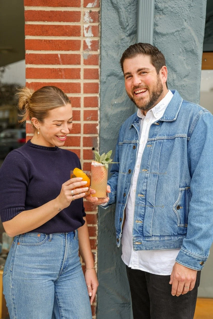 The team behind a professional bartending company sharing a drink together