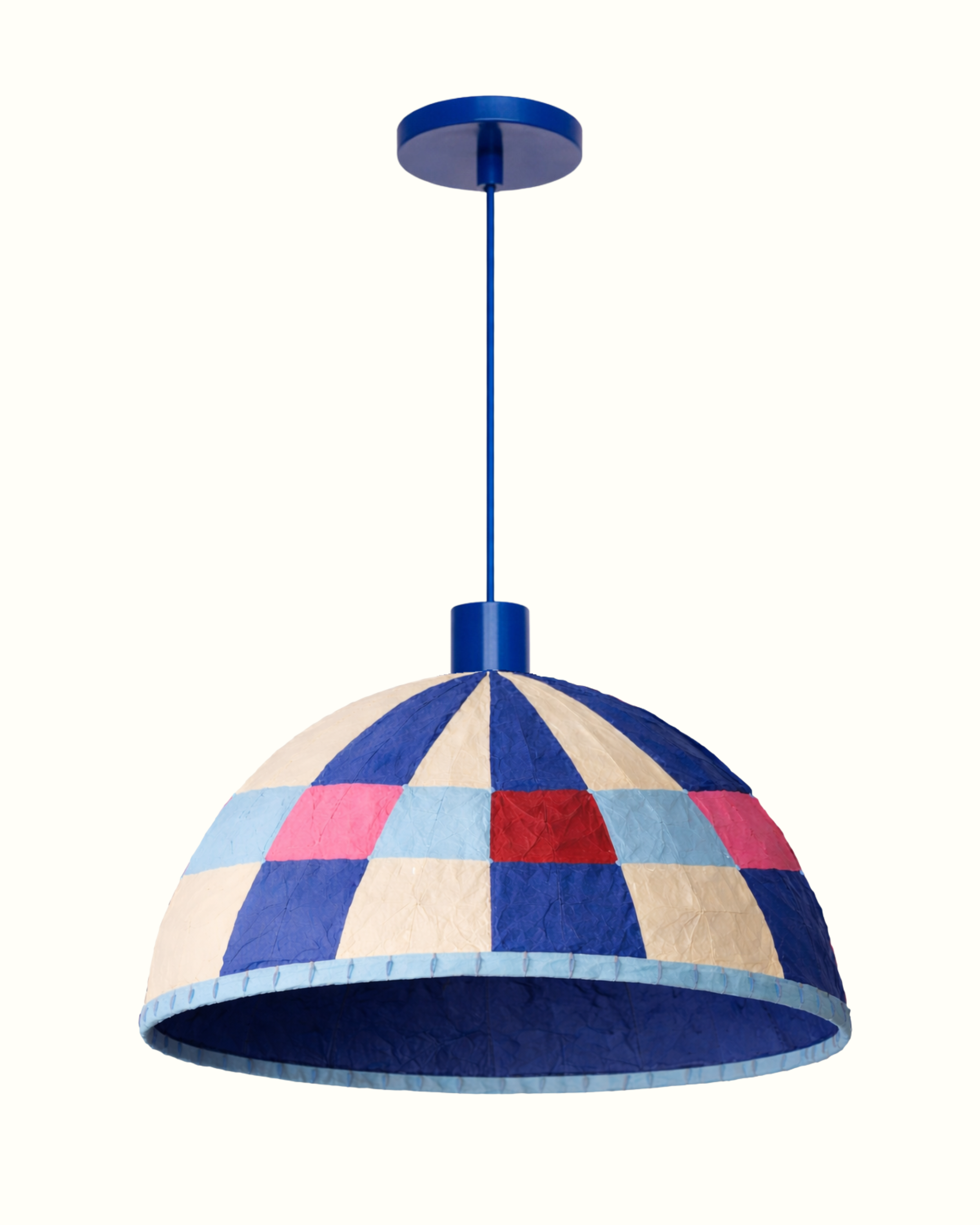 Colorful patchwork pendant lampshade with a blue ceiling mount.