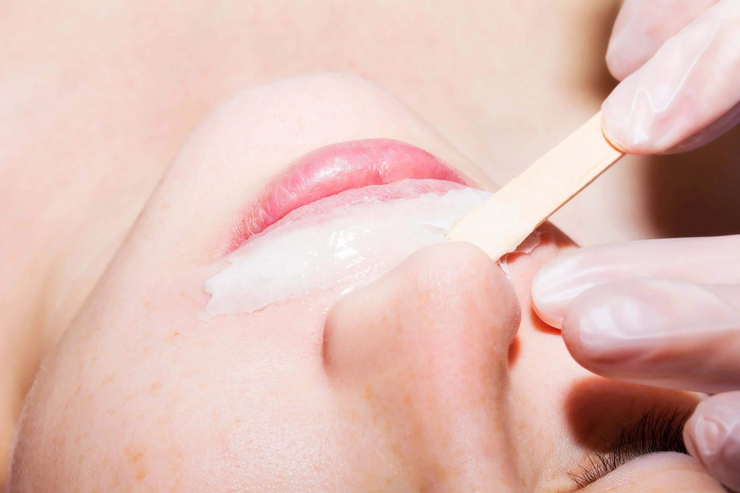 upper lip being waxed