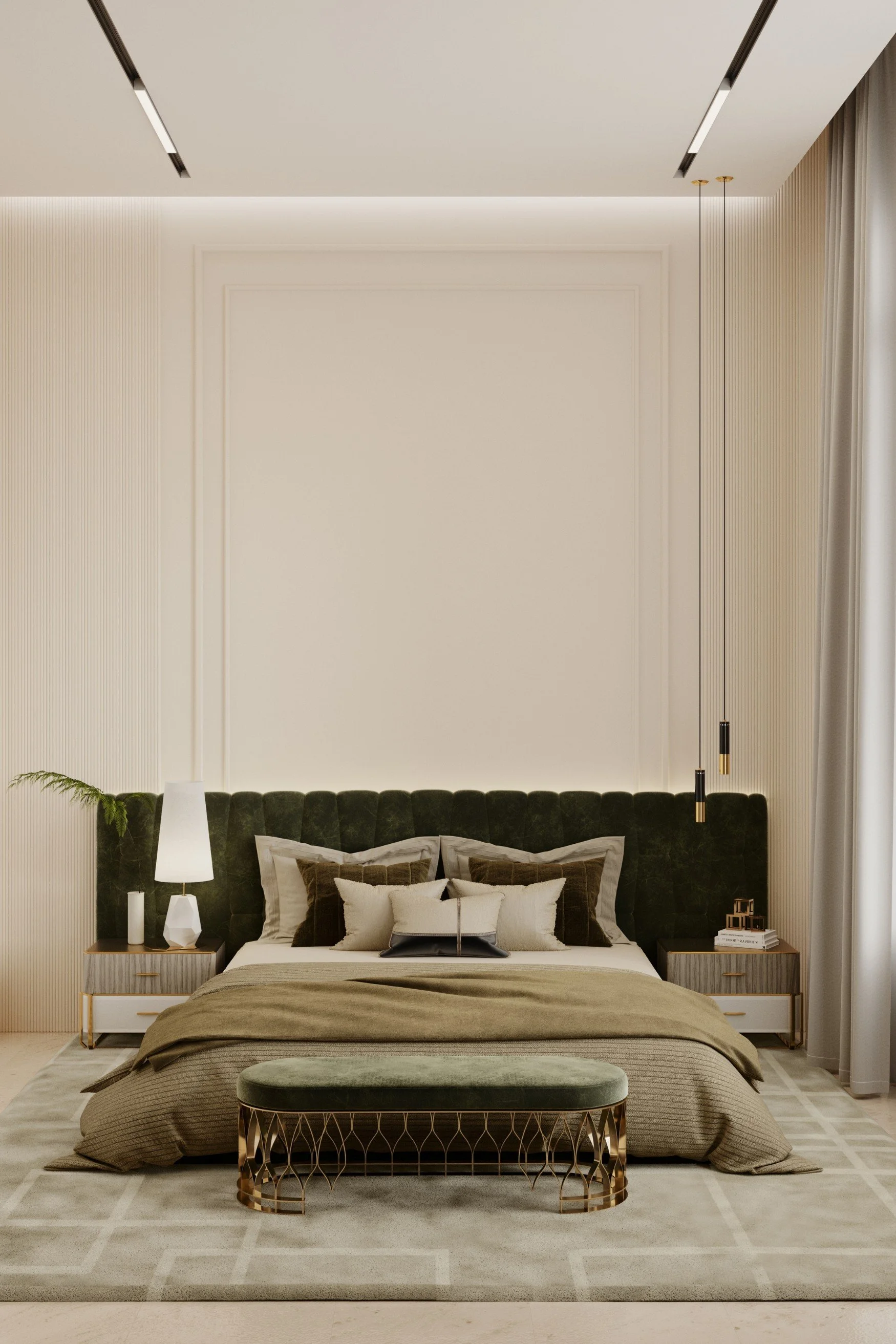 A room with a bed with beige and green linen and an extra wide headboard in green velvet and an ottoman also in green velvet at the end of the bed