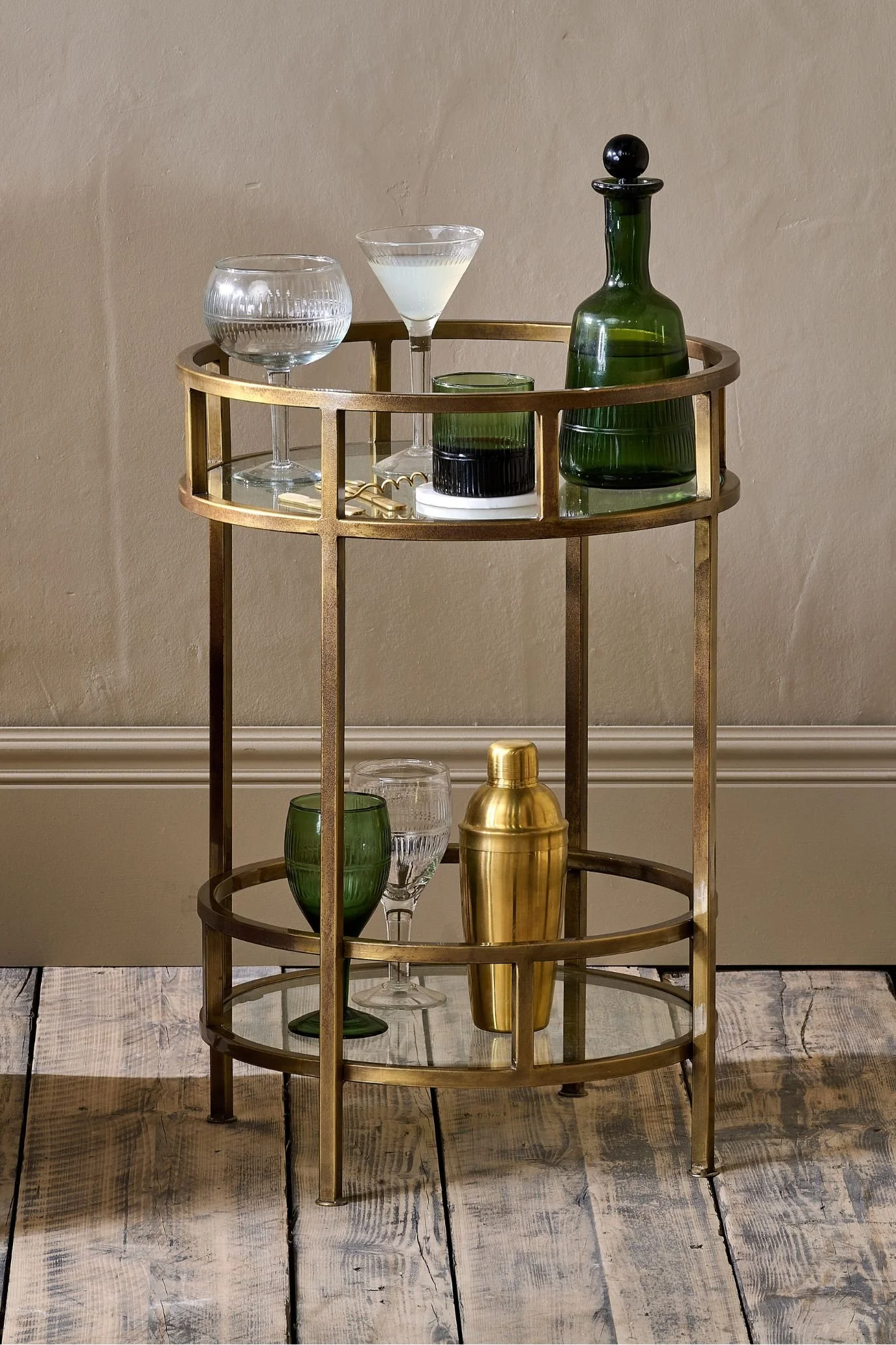 Small drinks table with bottles and cocktail accessories