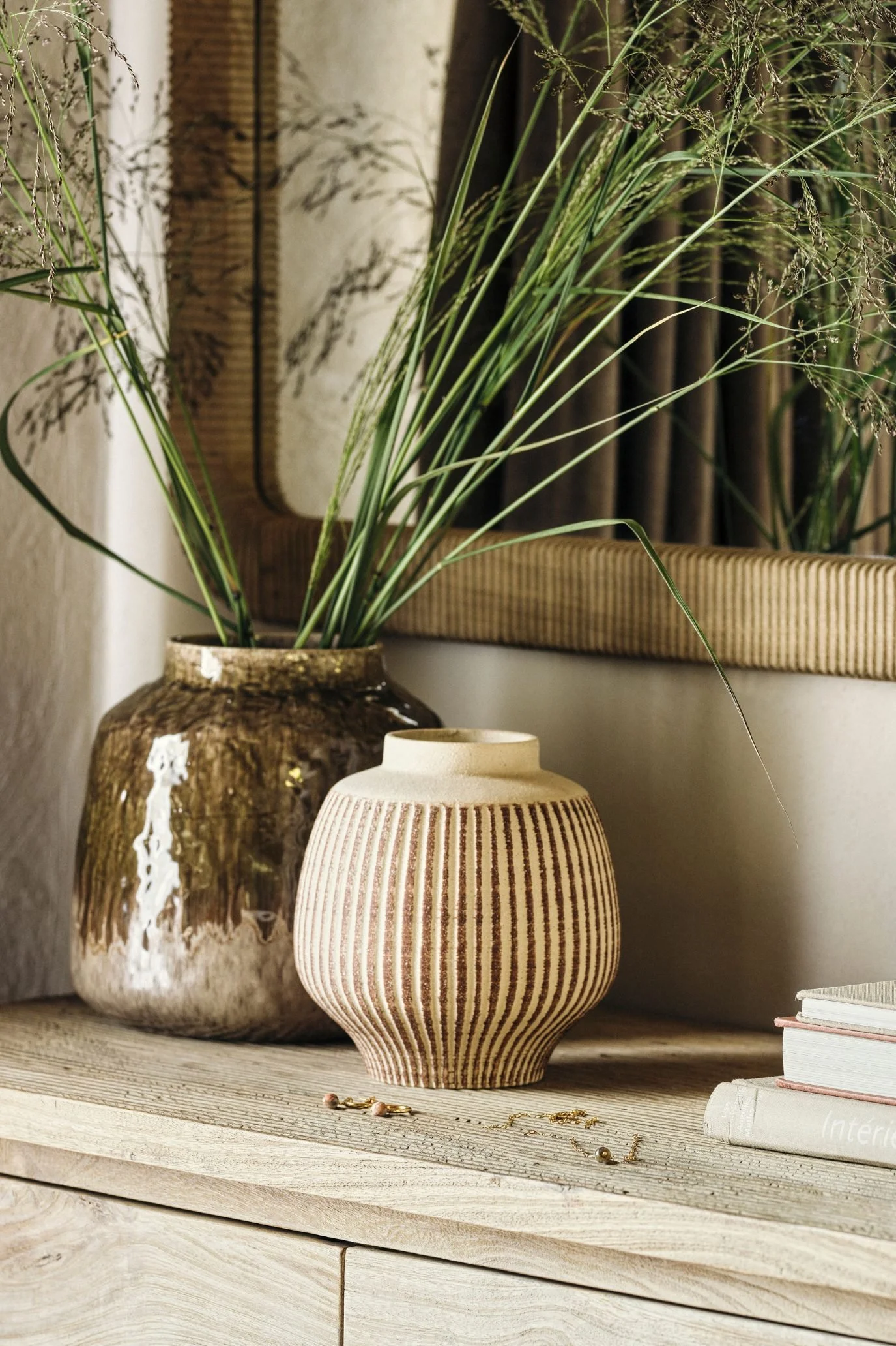 Glazed and ribbed ceramic modern vases in natural neutral tones.