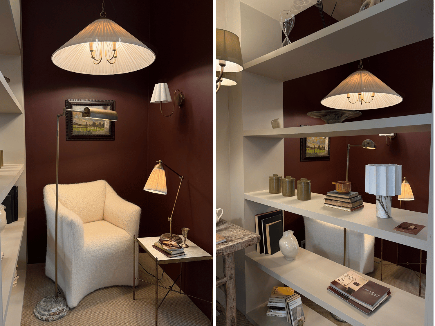 A room set with a cream sofa burgundy wall and cream lamps and pendant lights, on the right is white shelving with lamps and books
