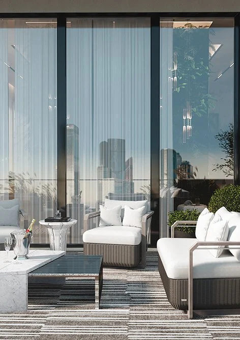 A luxurious looking outdoor seating area with a brown and white striped rug and white cushions