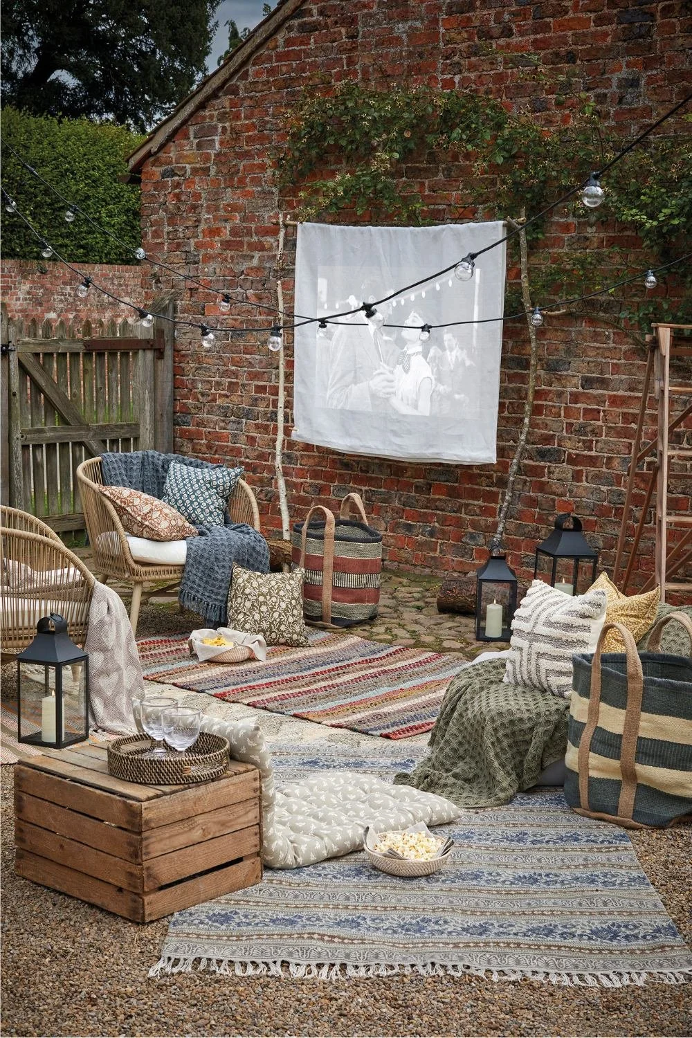 A seating area with a mixture of outdoor rugs