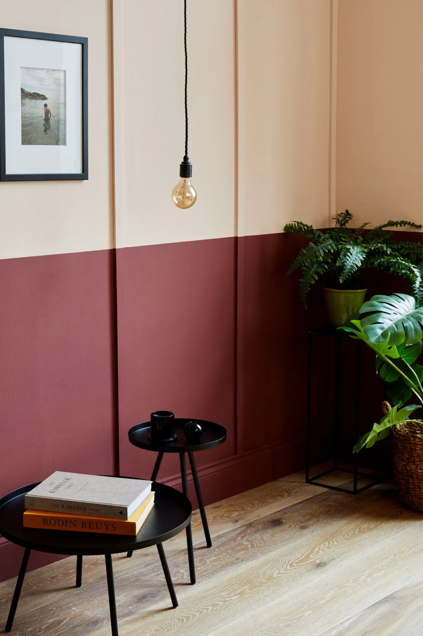 Two-tone wall painted in Earthborn Lady Bug burgundy and Peach Baby with deep red on the lower half.