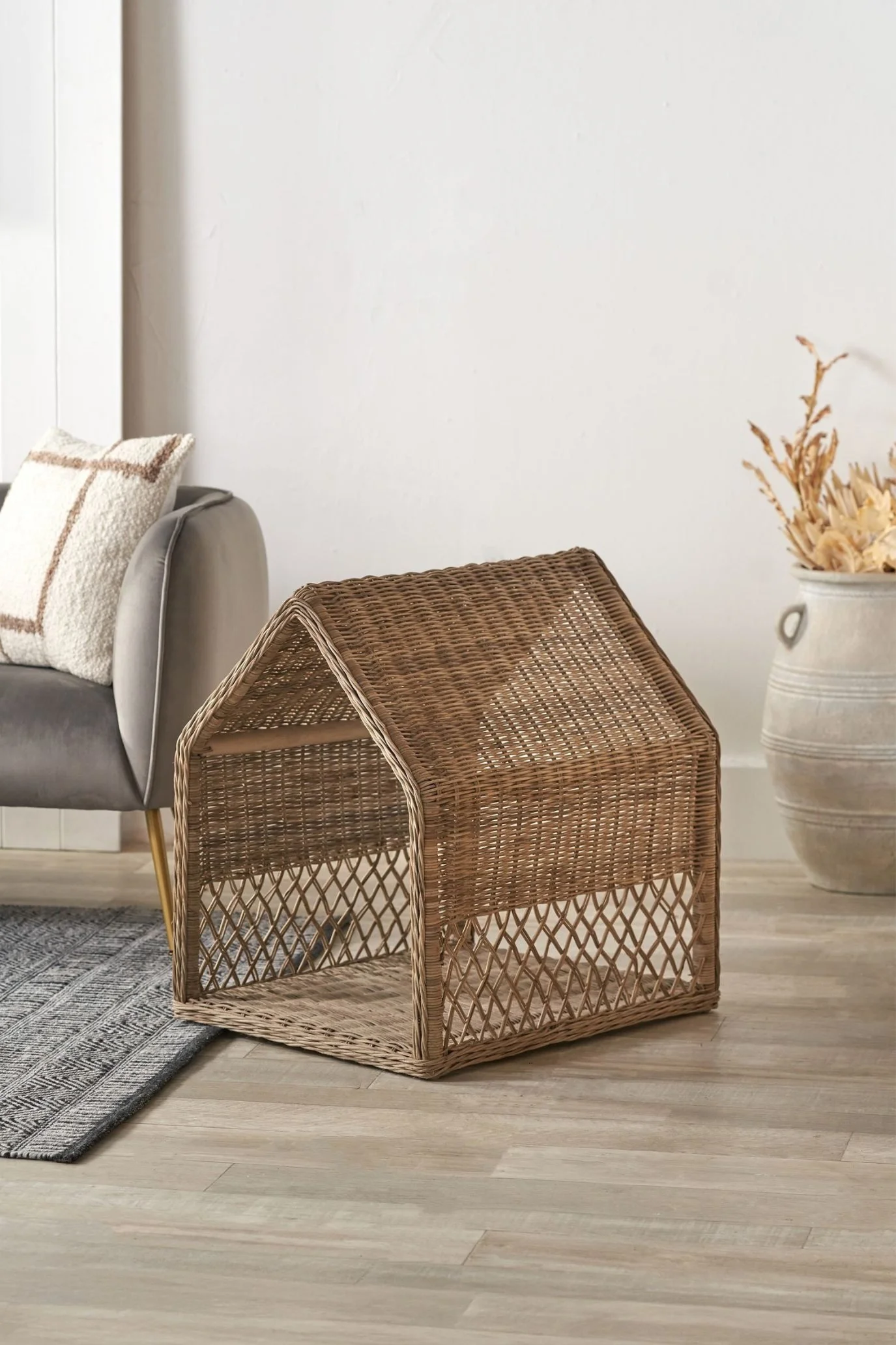 Handwoven rattan dog house with an enclosed sleeping space