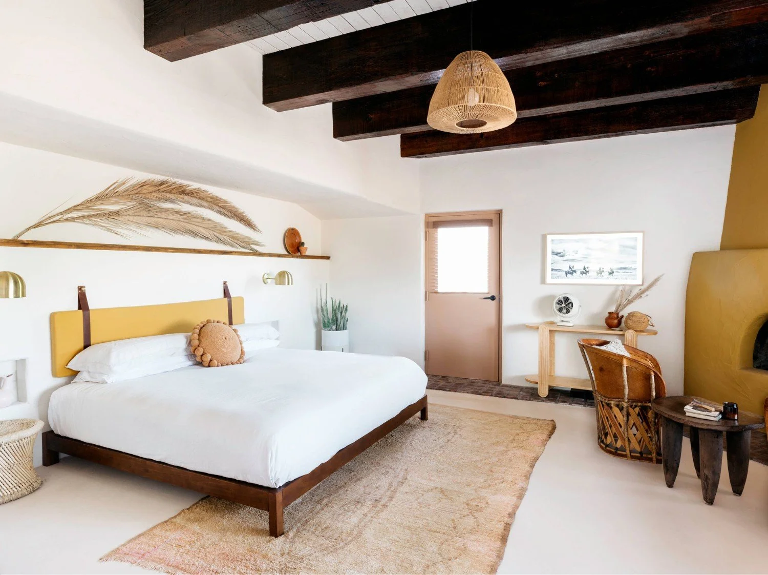 Bedroom at JTH Tucson styled with Moroccan rugs, warm earthy tones and natural textures