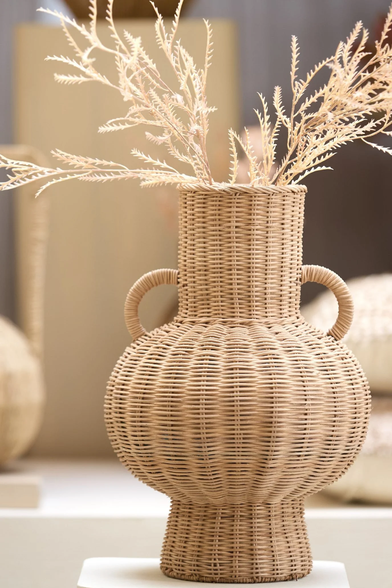 Rattan Quirky decorative vase with an unusual sculptural shape and textured finish.