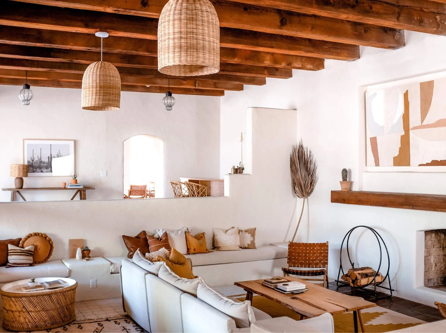 Living room at JTH Tucson with whitewashed walls, bancos seating and earthy Southwestern styling