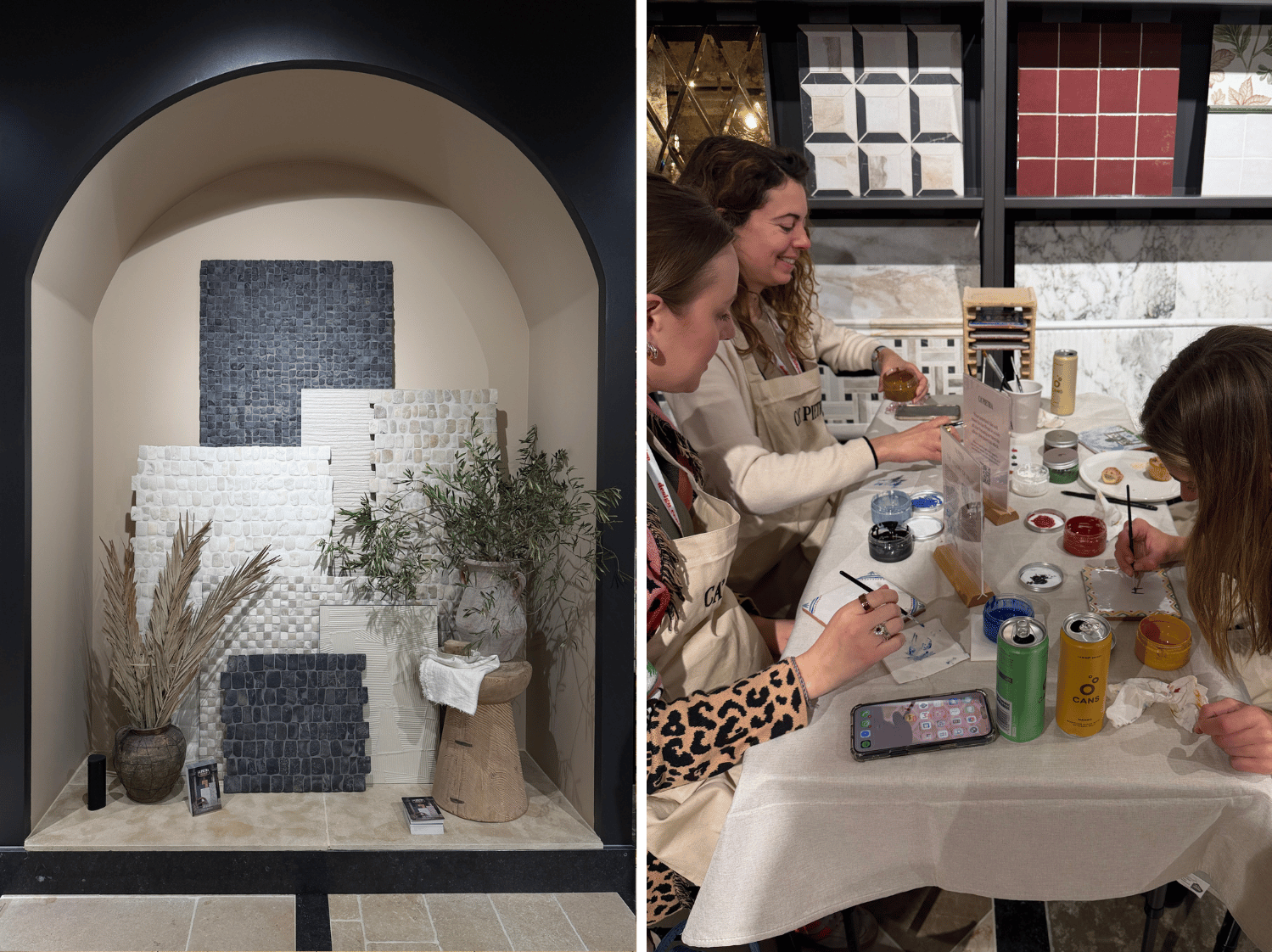 A large arch with tile samples inside and two antique pots with branches on the right four ladies painting tiles